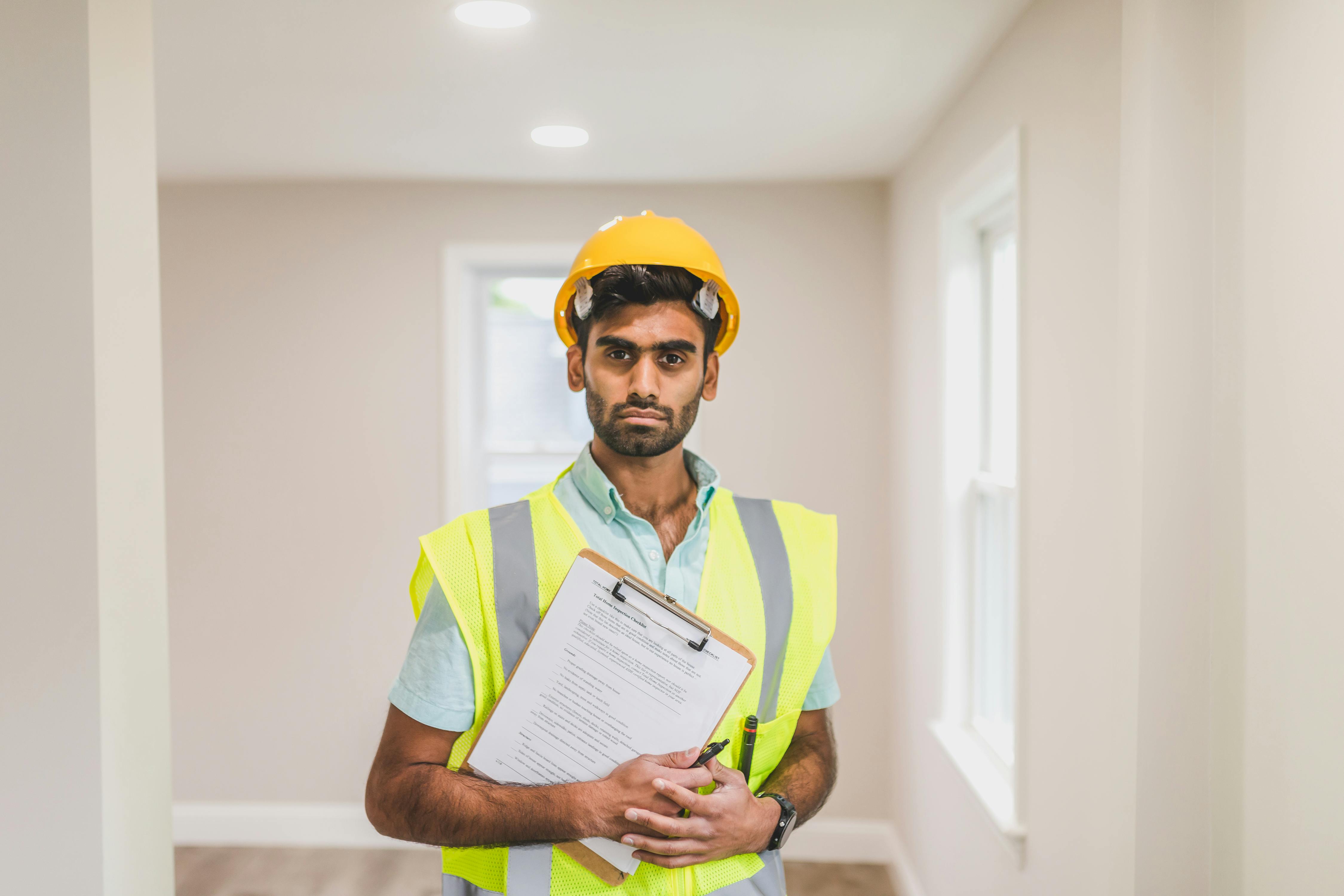Inspector with clipboard in a home interior